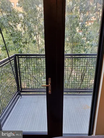 a view of a balcony with wooden floor