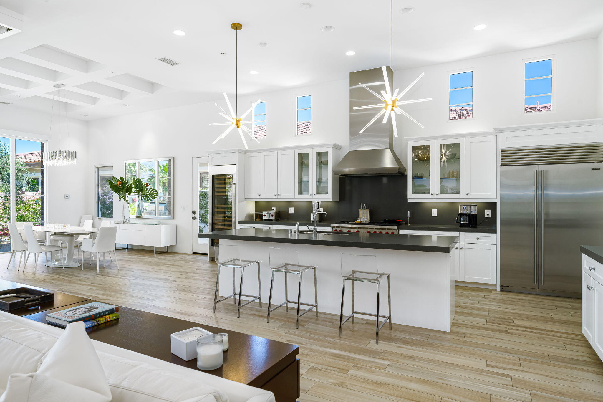 59805 Seville La Quinta, CA 92253 - Photo 17 of 61 a living room with stainless steel appliances granite countertop a kitchen island a stove a sink a refrigerator and a cabinets