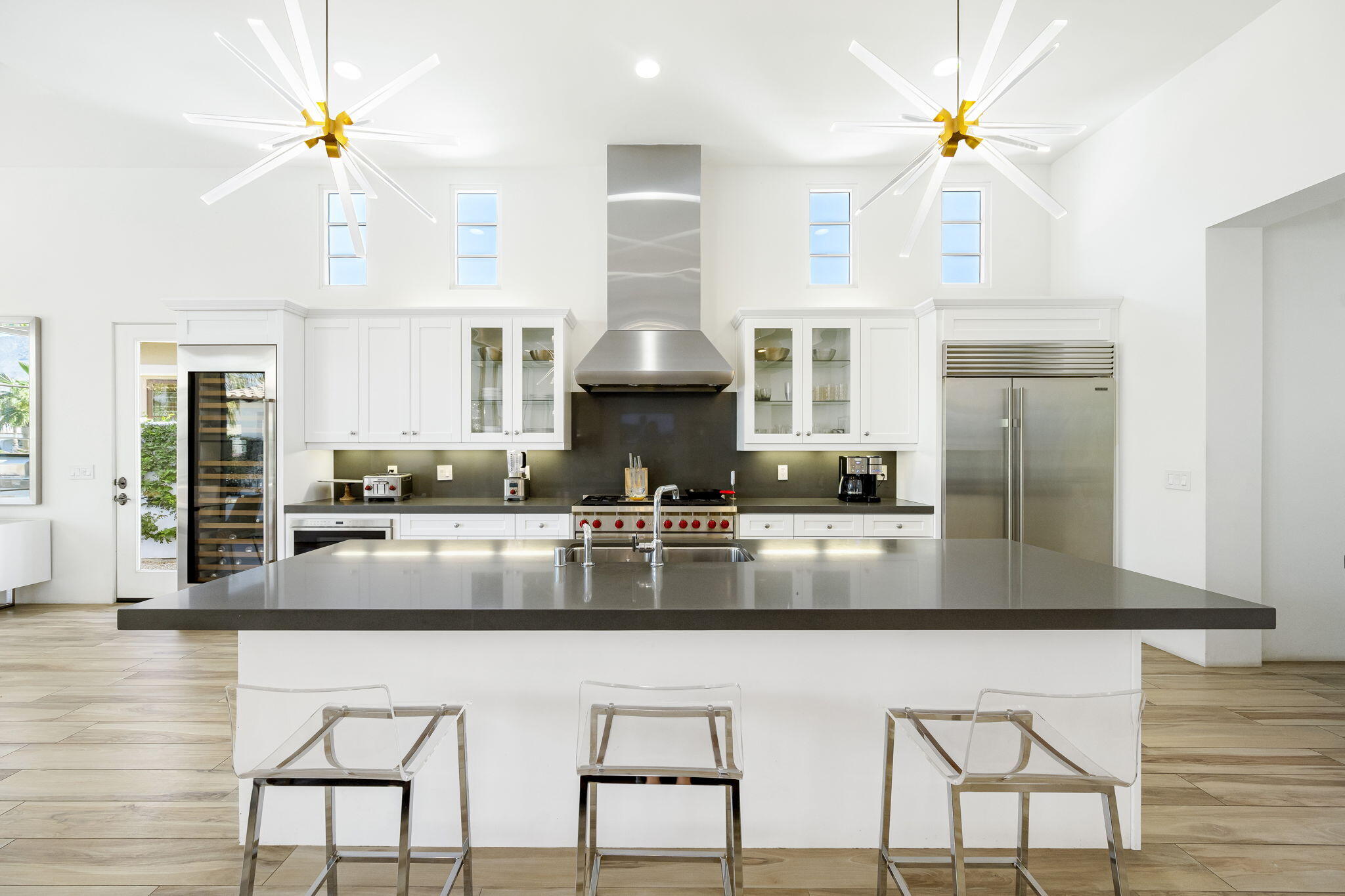 59805 Seville La Quinta, CA 92253 - Photo 19 of 61 a kitchen with stainless steel appliances granite countertop a stove refrigerator and cabinets