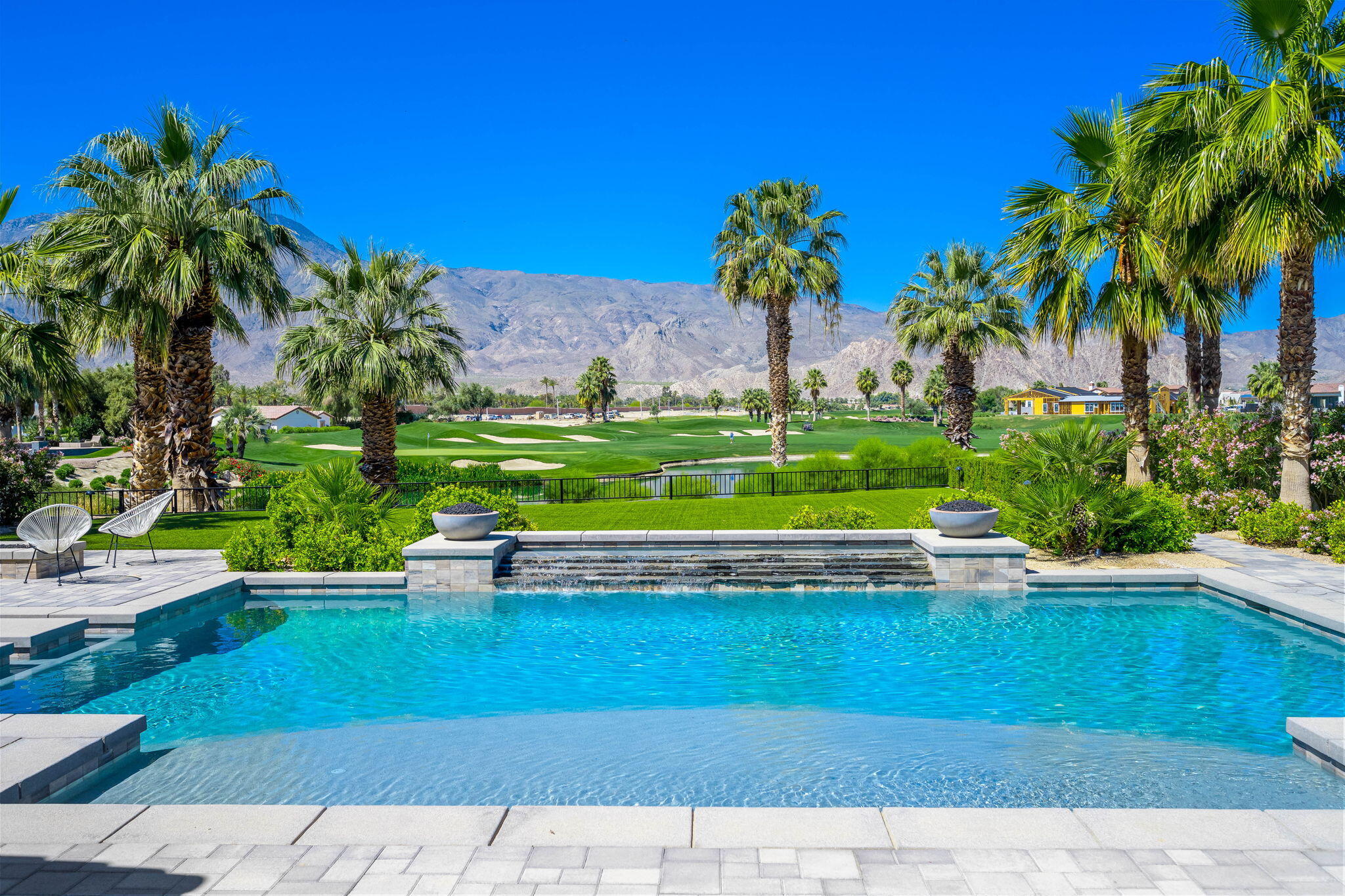 59805 Seville La Quinta, CA 92253 - Photo 2 of 61 a view of a garden with a bench