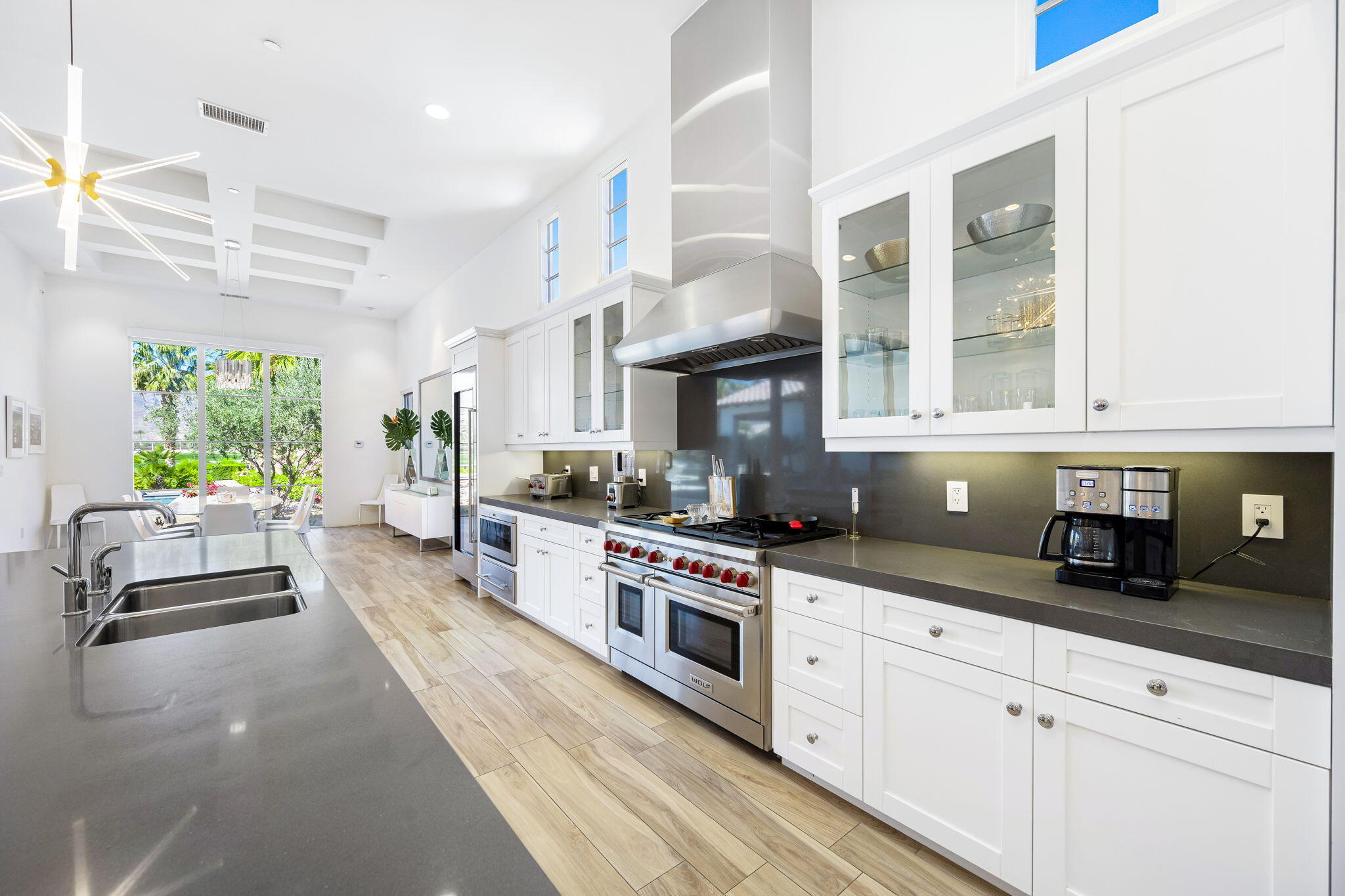 59805 Seville La Quinta, CA 92253 - Photo 20 of 61 a kitchen with cabinets and window