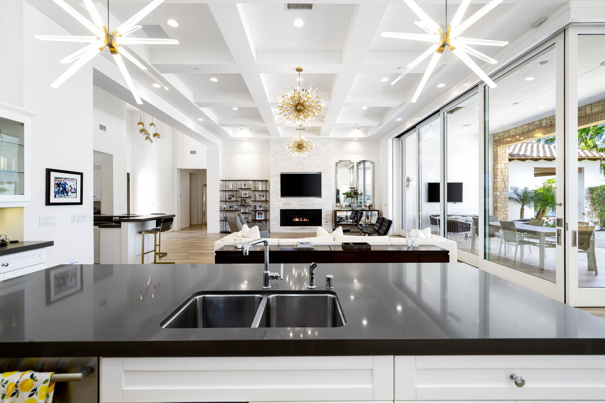 59805 Seville La Quinta, CA 92253 - Photo 22 of 61 a living room with kitchen island furniture and a flat screen tv
