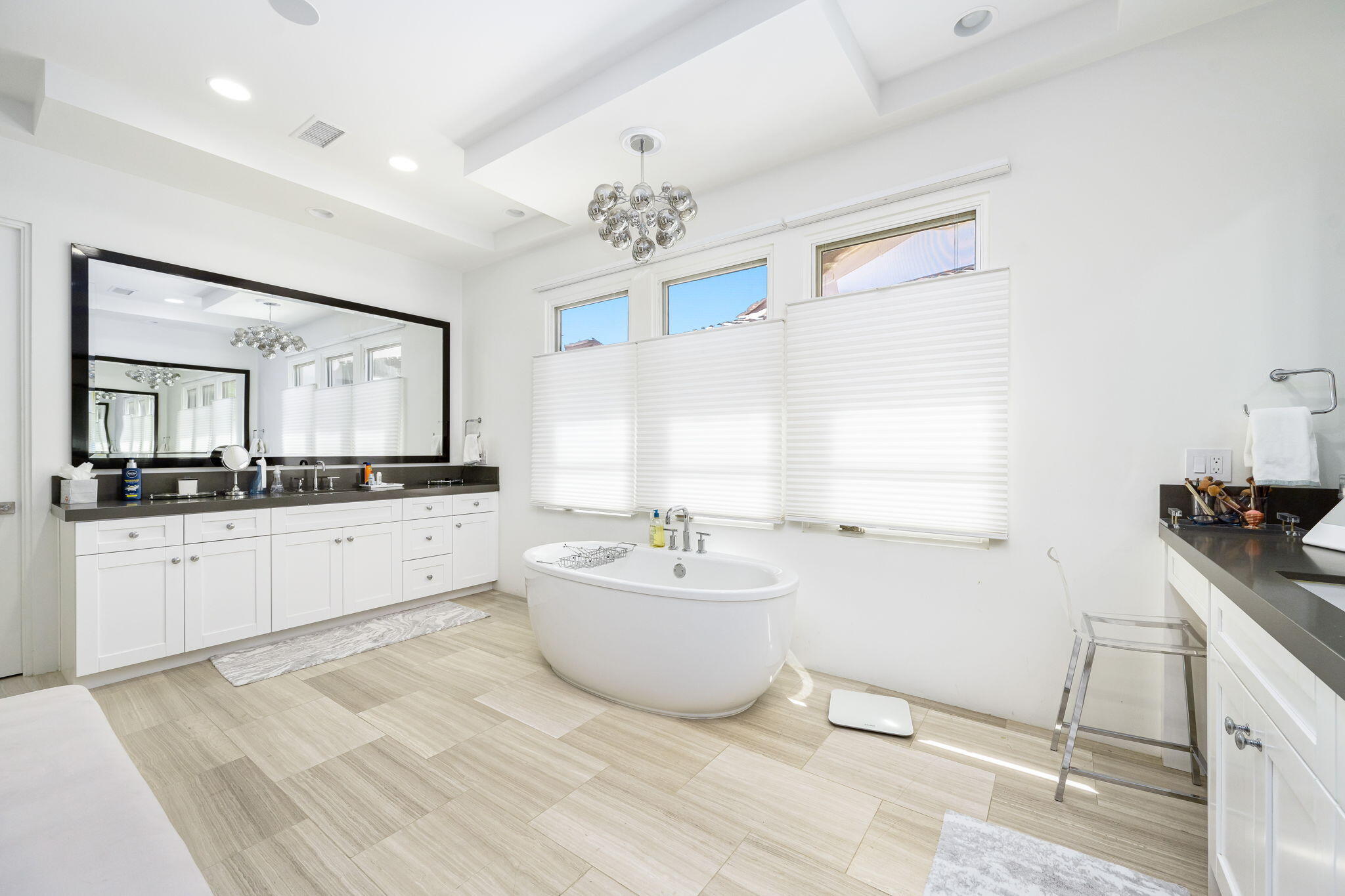 59805 Seville La Quinta, CA 92253 - Photo 27 of 61 a spacious bathroom with a double vanity sink a mirror and a bathtub