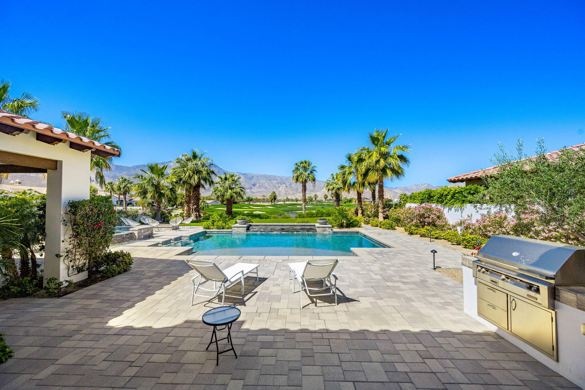 59805 Seville La Quinta, CA 92253 - Photo 3 of 61 a view of a backyard with plants and outdoor seating