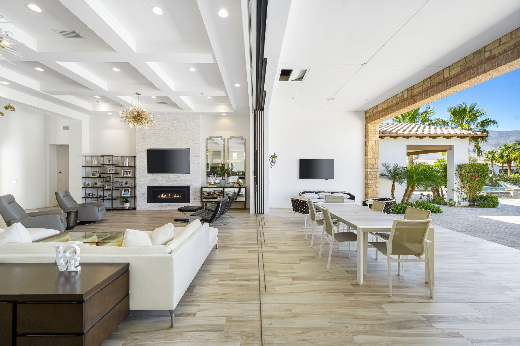 59805 Seville La Quinta, CA 92253 - Photo 31 of 61 a living room with furniture wooden floor and a flat screen tv