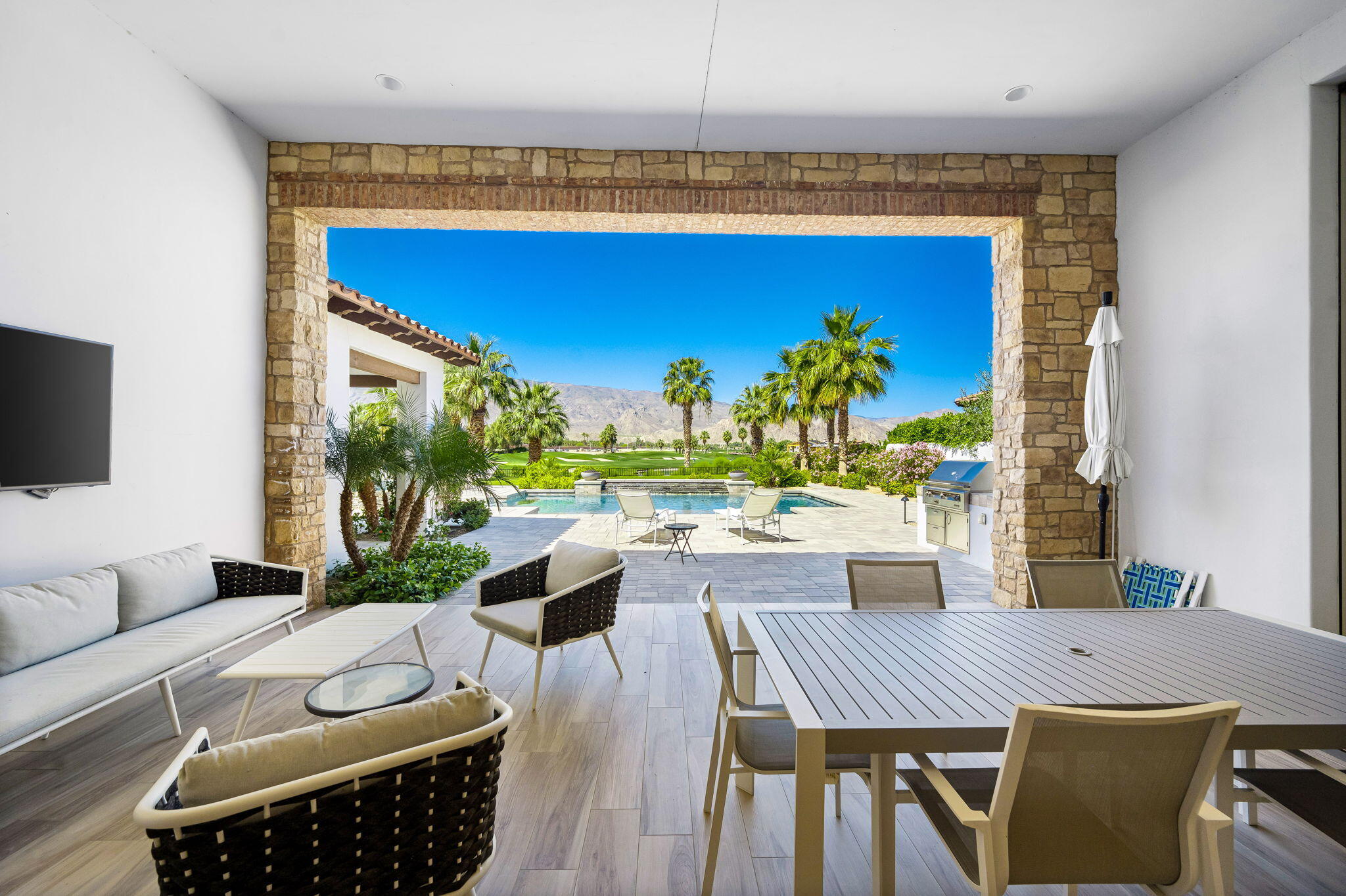 59805 Seville La Quinta, CA 92253 - Photo 32 of 61 a view of a dining room with furniture window and outside view