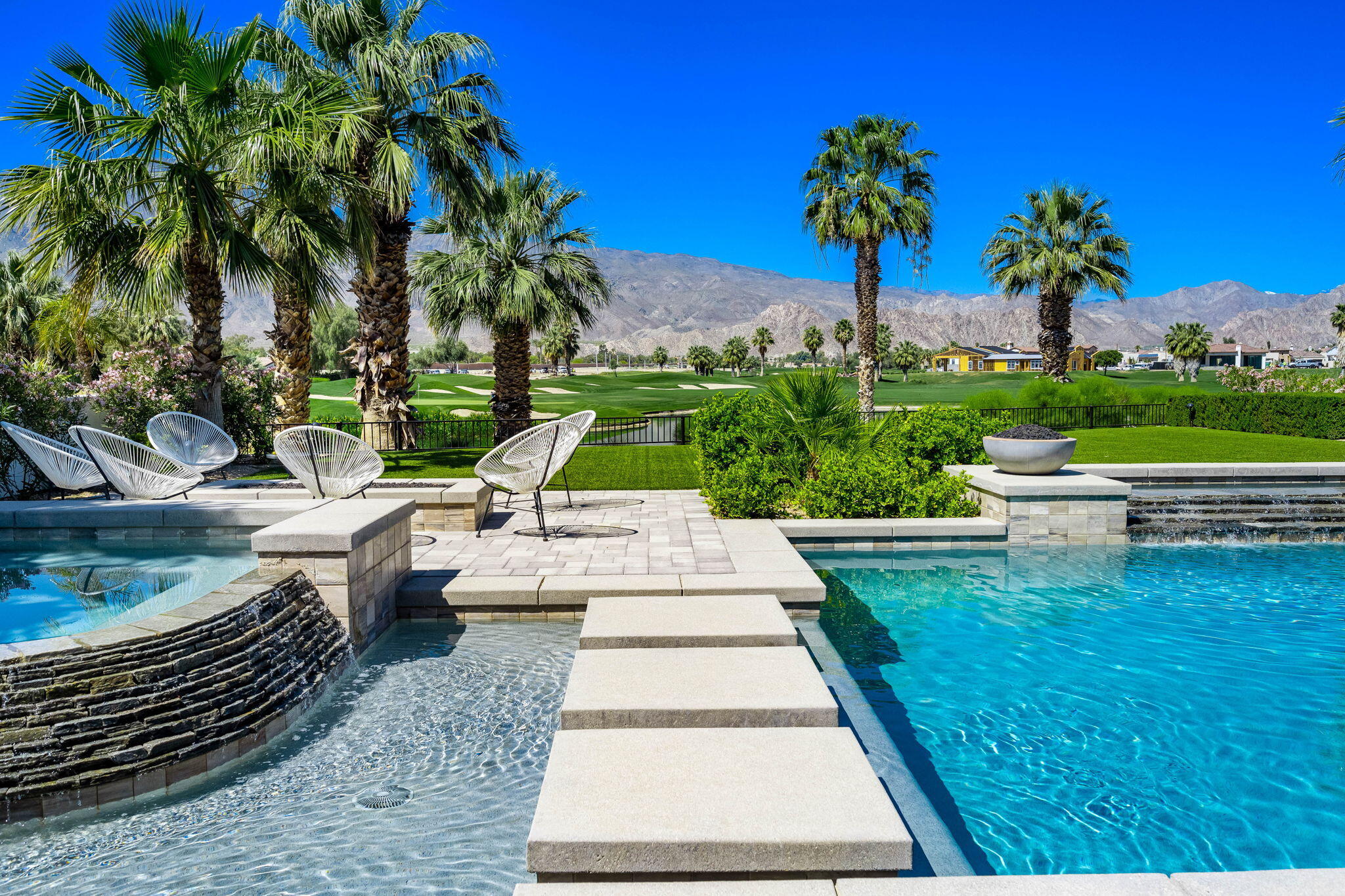 59805 Seville La Quinta, CA 92253 - Photo 34 of 61 a view of a swimming pool with a patio and a garden