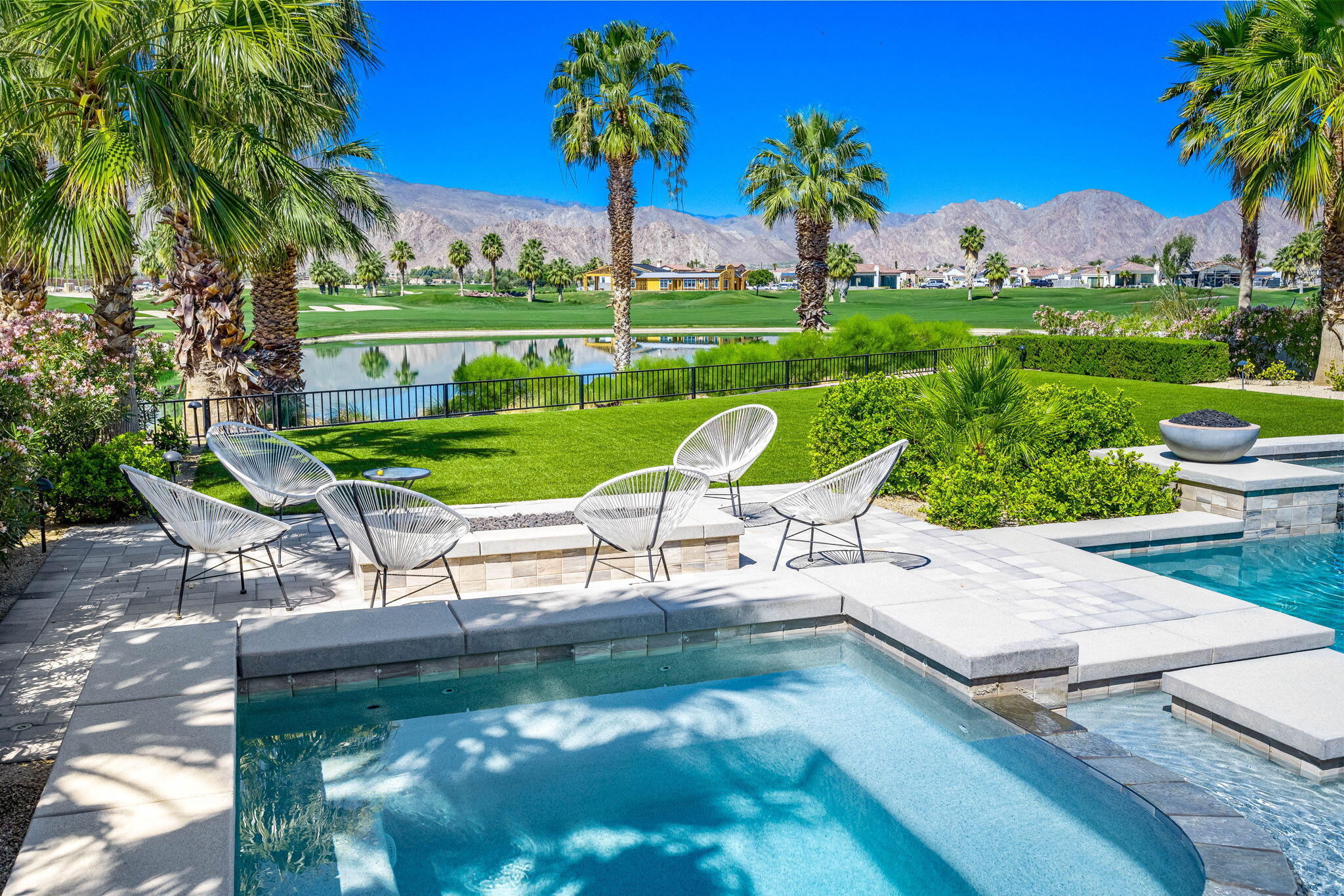 59805 Seville La Quinta, CA 92253 - Photo 35 of 61 a view of a garden with a table and chairs