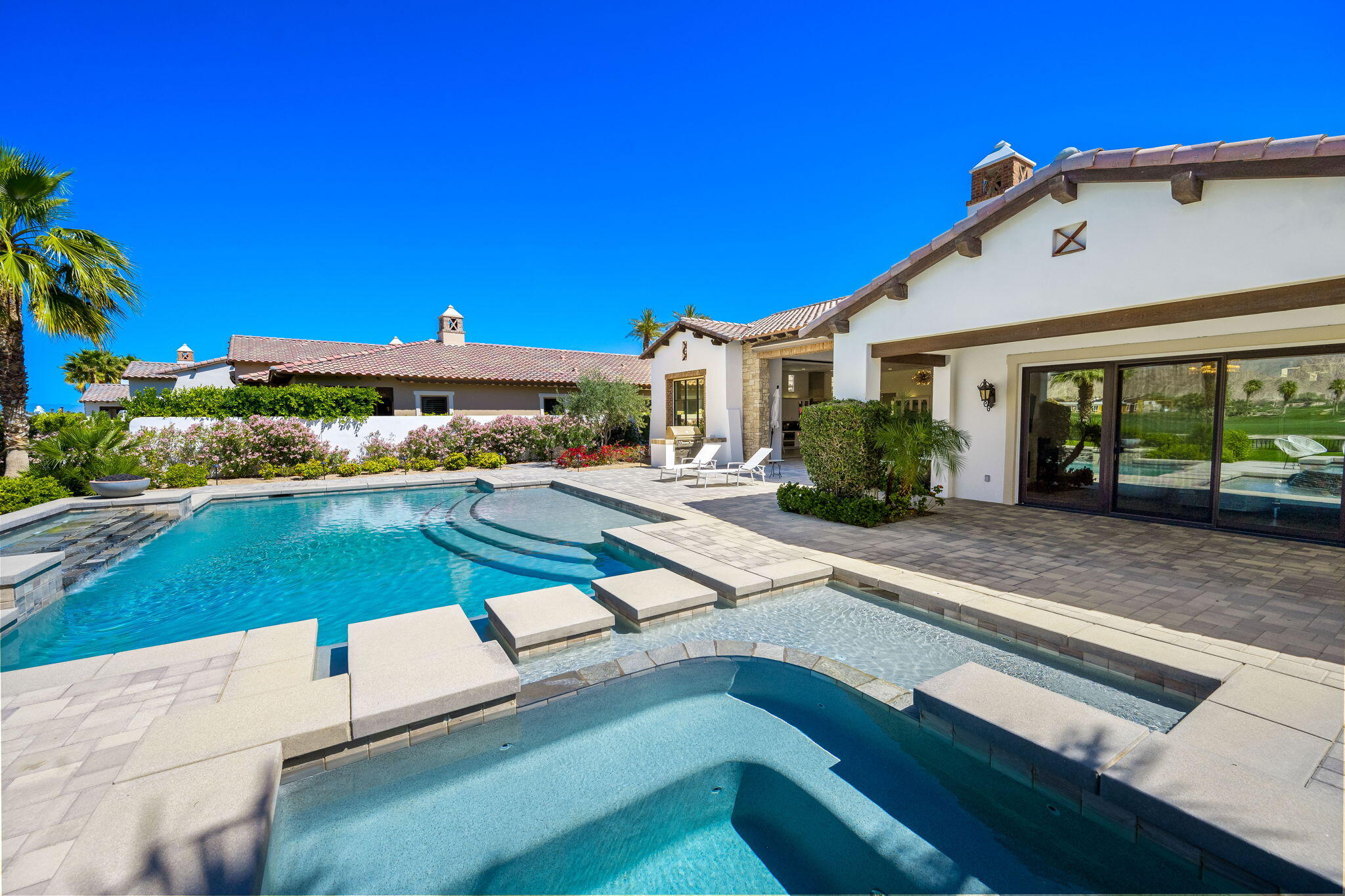 59805 Seville La Quinta, CA 92253 - Photo 37 of 61 a view of a house with pool and chairs