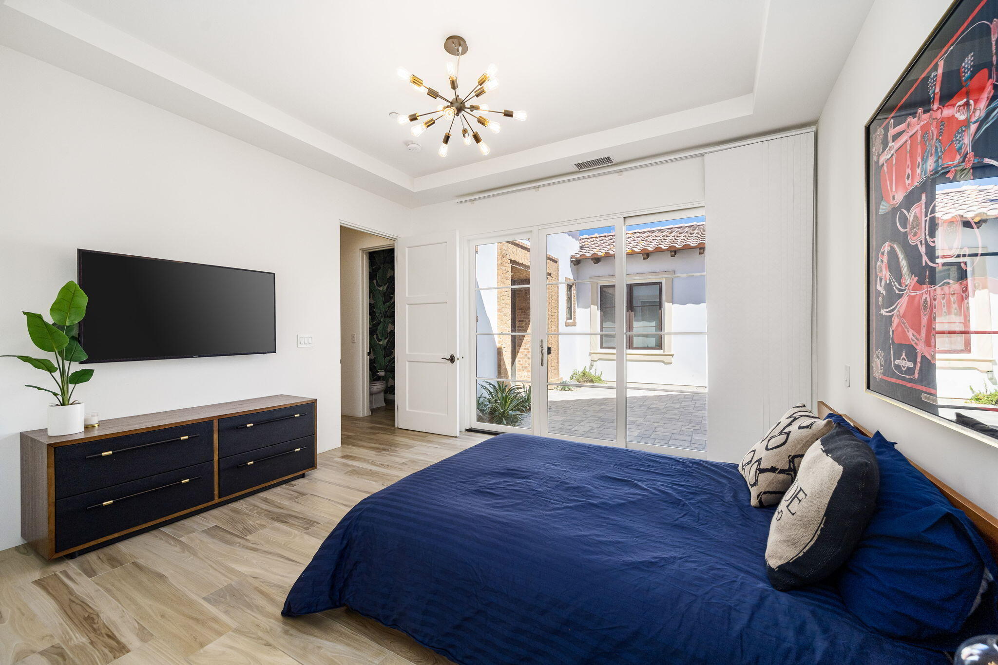 59805 Seville La Quinta, CA 92253 - Photo 39 of 61 a spacious bedroom with a bed and a flat screen tv