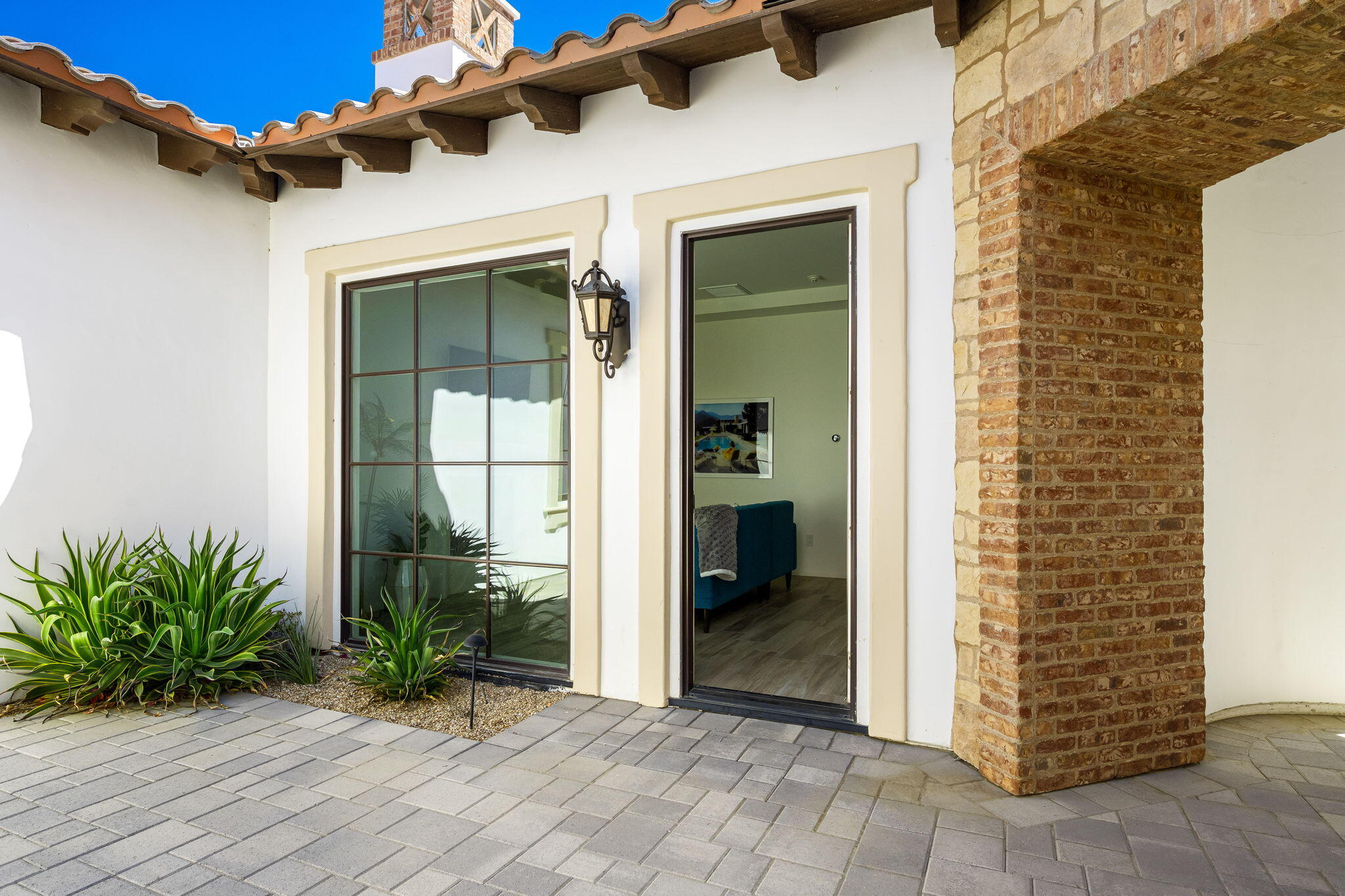 59805 Seville La Quinta, CA 92253 - Photo 43 of 61 a view of front door and potted plants