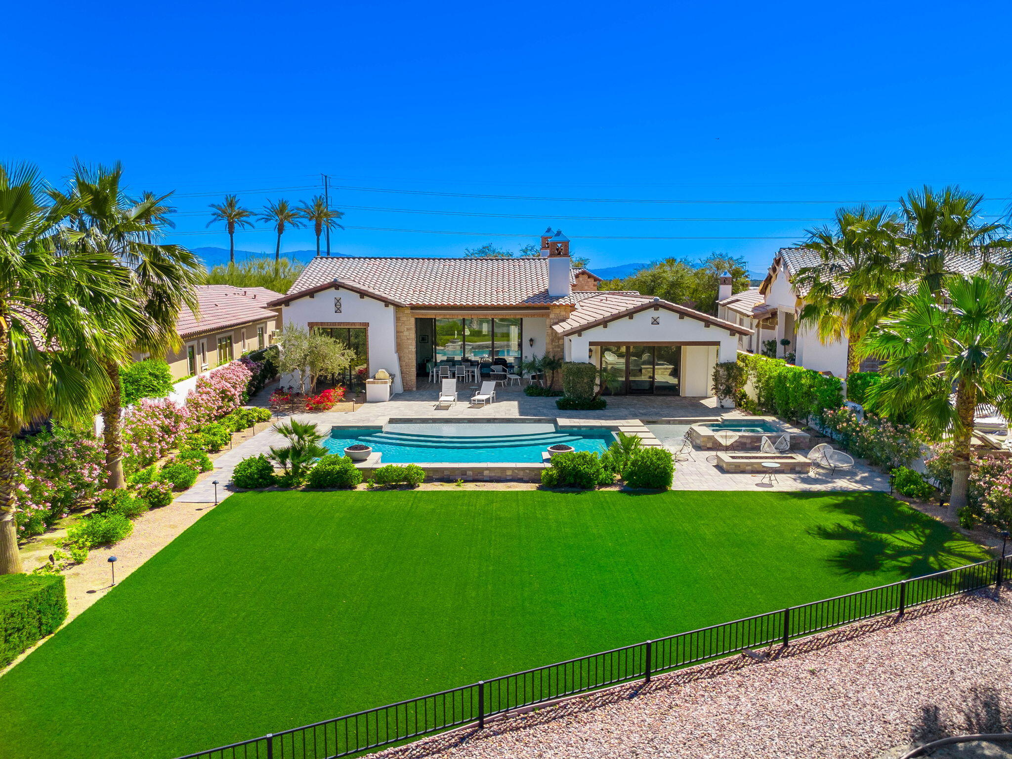 59805 Seville La Quinta, CA 92253 - Photo 50 of 61 a front view of a house with garden