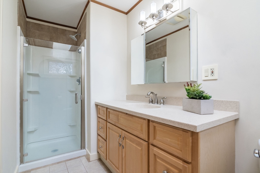 29 Rattle Hill Road Southampton, MA 01073 - Photo 31 of 42 a bathroom with a sink vanity granite and a mirror
