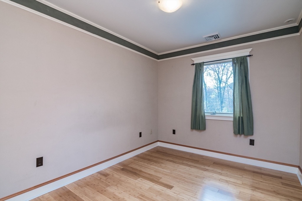29 Rattle Hill Road Southampton, MA 01073 - Photo 33 of 42 a view of empty room with wooden floor and fan