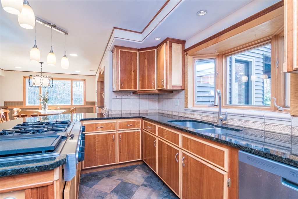 29 Rattle Hill Road Southampton, MA 01073 - Photo 8 of 42 a kitchen with granite countertop a sink stove and cabinets