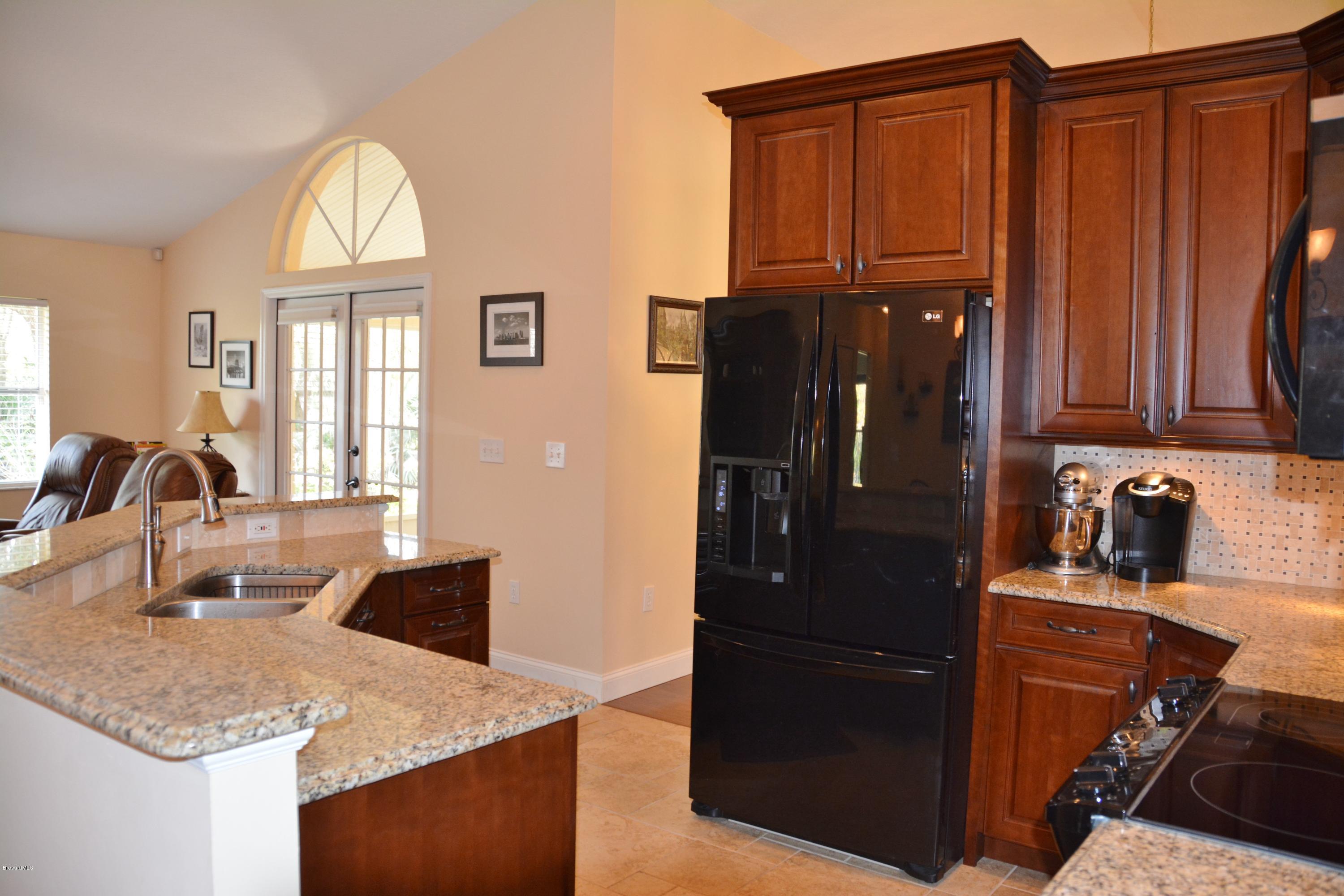 4453 Long Lake Road Melbourne, FL 32934 - Photo 14 of 42 KITCHEN - VIEW TOWARDS FRENCH DOORS