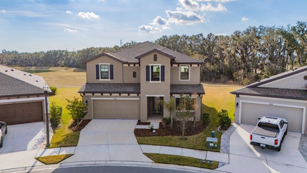14604 Horse Trot Road Lithia, FL 33547 - Photo 49 of 62 a front view of a house with a garden