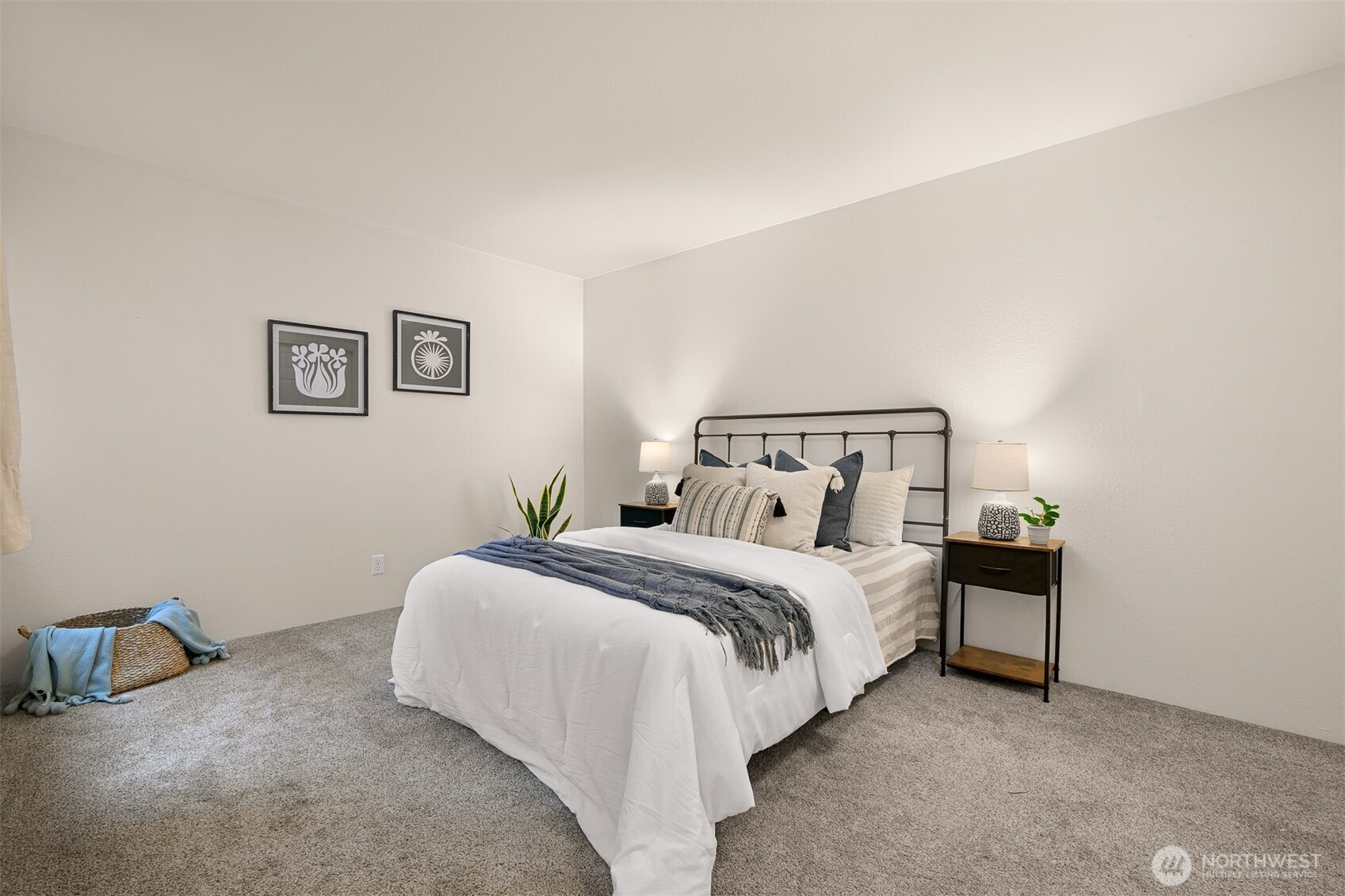 444 South State Street, Unit 317 Bellingham, WA 98225 - Photo 16 of 27 a bedroom with a bed and a lamp on the dresser