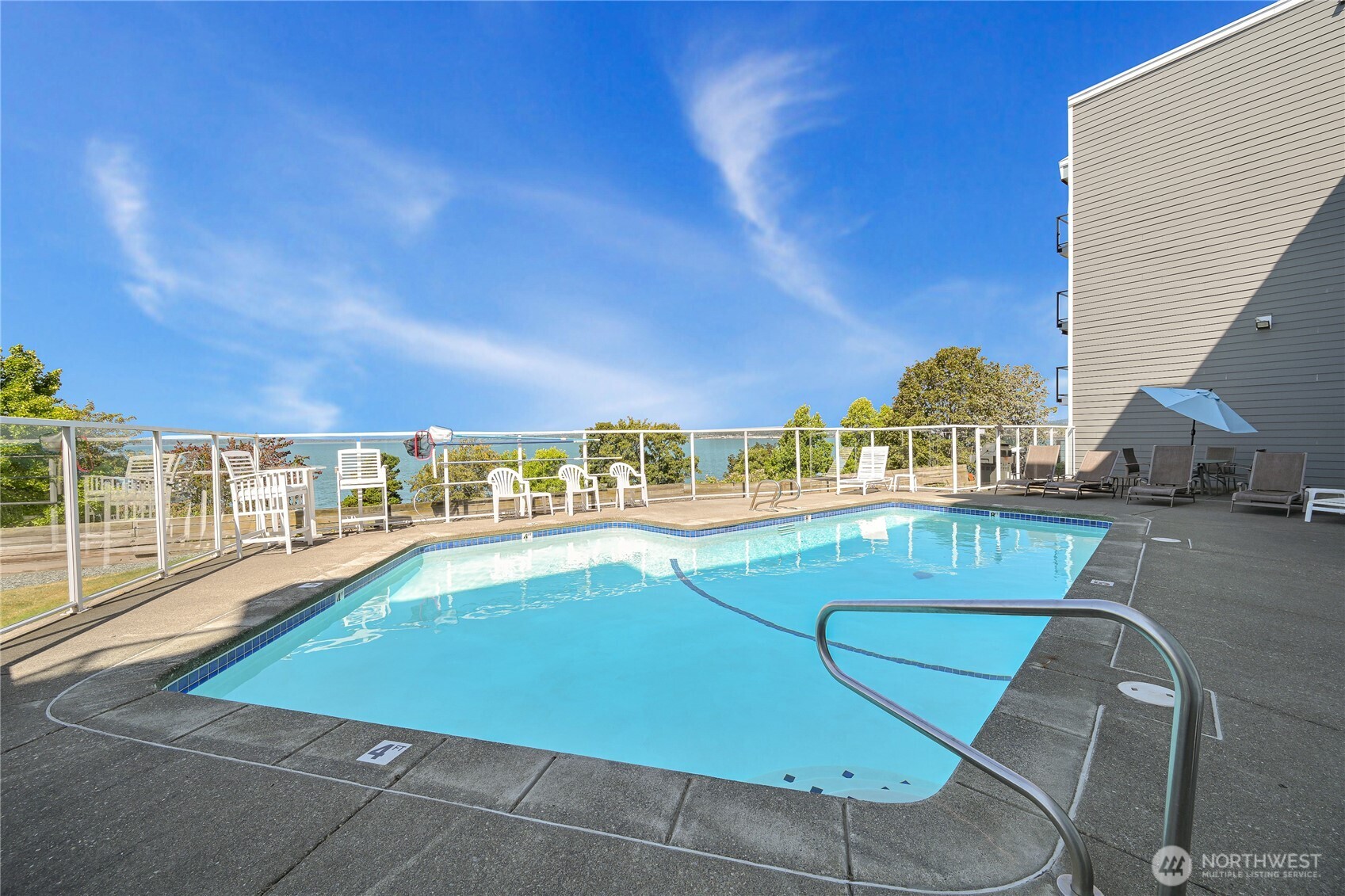 444 South State Street, Unit 317 Bellingham, WA 98225 - Photo 21 of 27 a view of a swimming pool with a lawn chairs