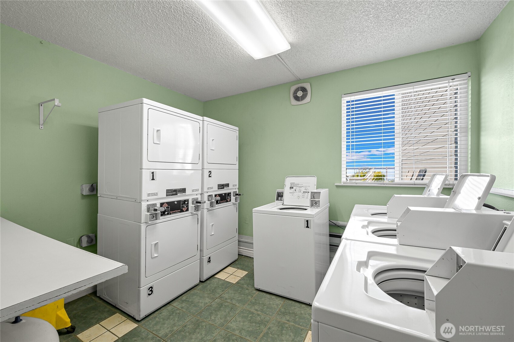 444 South State Street, Unit 317 Bellingham, WA 98225 - Photo 23 of 27 a storage room with a washer and dryer