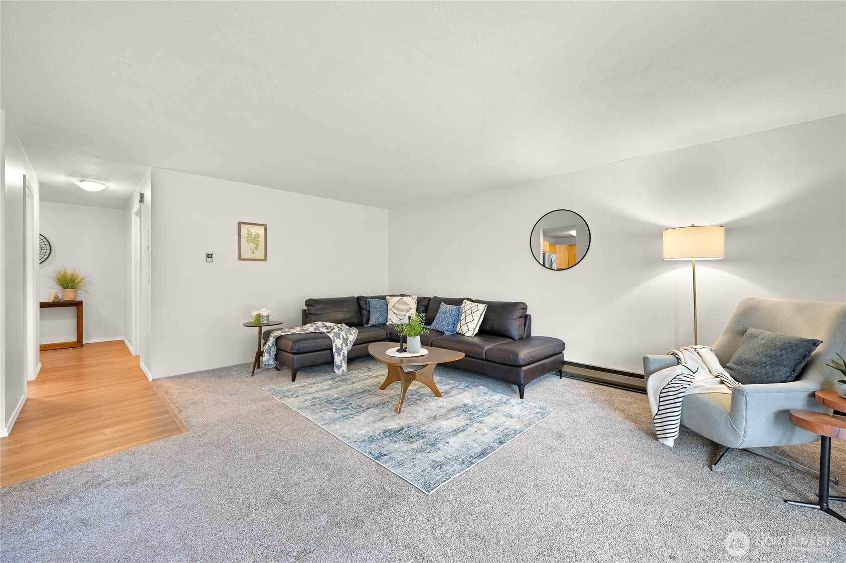 444 South State Street, Unit 317 Bellingham, WA 98225 - Photo 6 of 27 a living room with furniture and a lamp