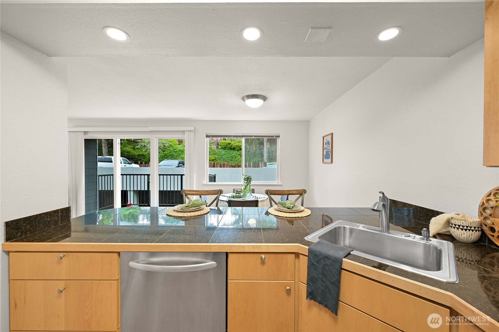 444 South State Street, Unit 317 Bellingham, WA 98225 - Photo 9 of 27 a kitchen with sink a stove and cabinets