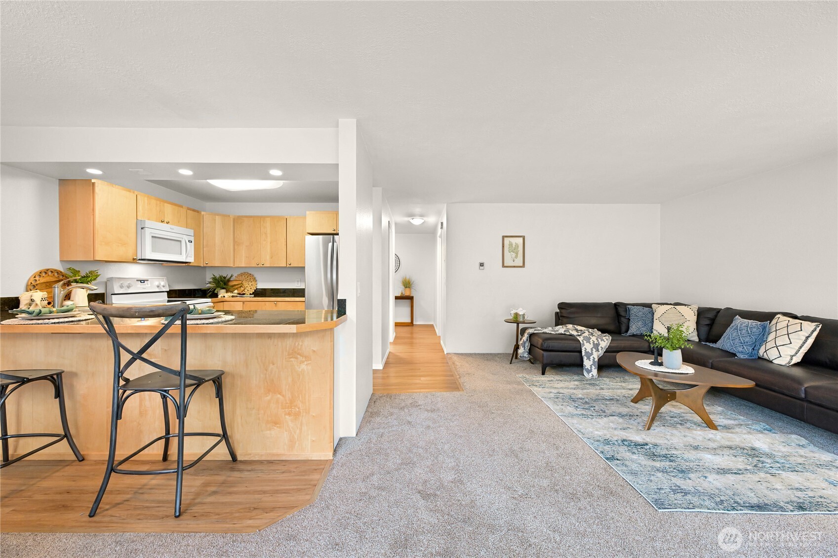 444 South State Street, Unit 317 Bellingham, WA 98225 - Photo 10 of 27 a living room with furniture and a table