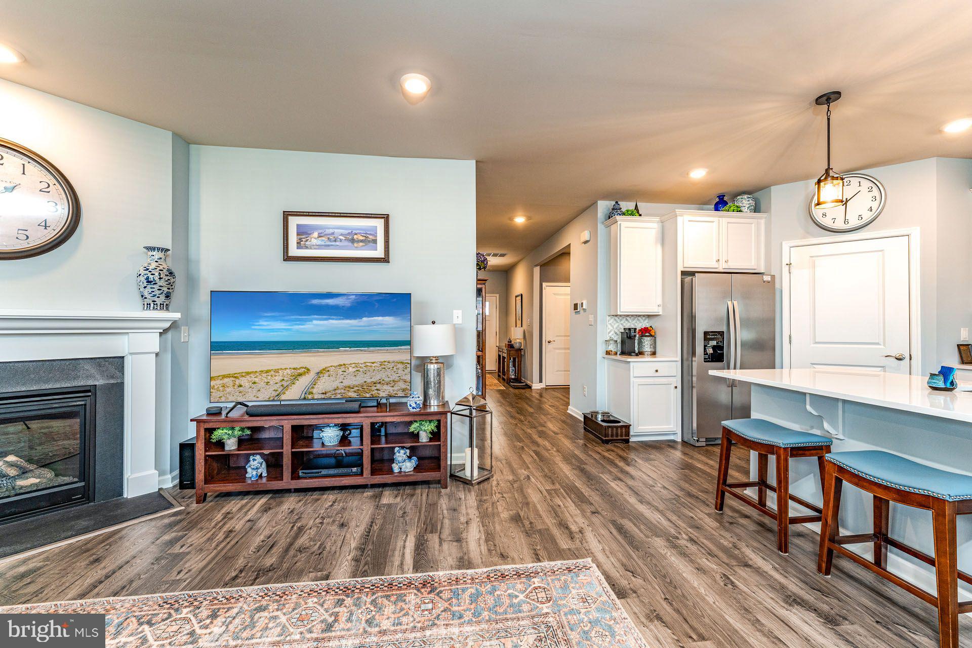 36 Walton Way Delanco, NJ 08075 - Photo 15 of 39 a living room with furniture a fireplace and a chandelier