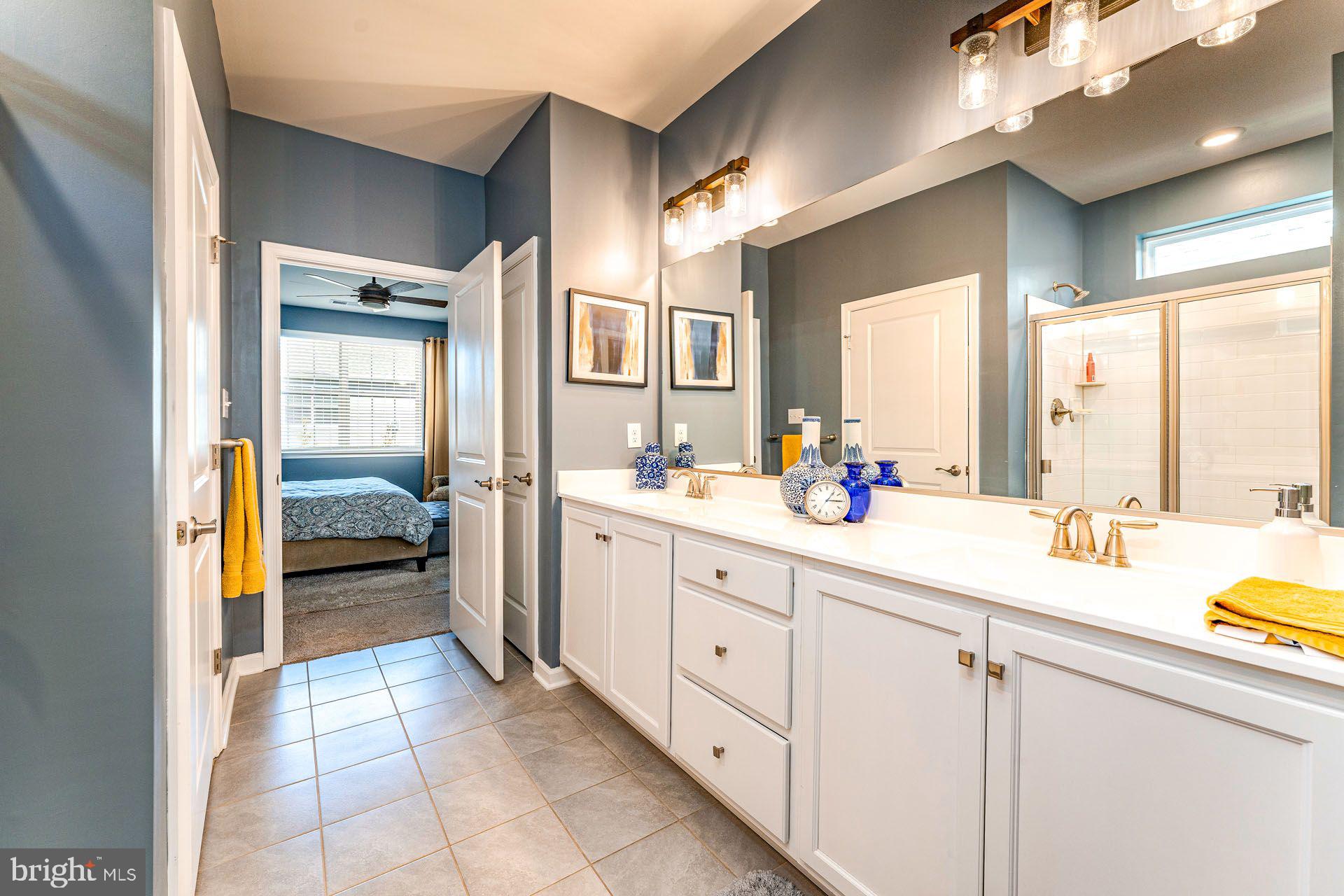 36 Walton Way Delanco, NJ 08075 - Photo 19 of 39 a spacious en suite bathroom with a granite countertop sink mirror and bathtub