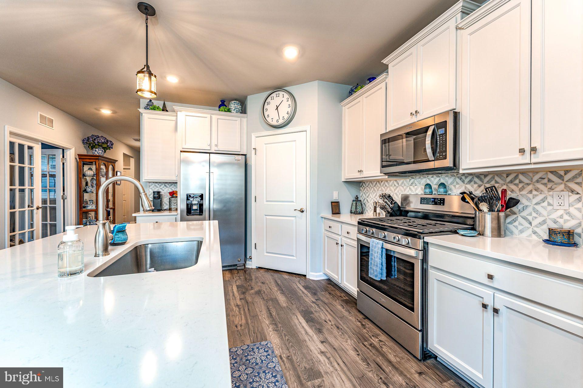 36 Walton Way Delanco, NJ 08075 - Photo 6 of 39 a kitchen with stainless steel appliances granite countertop a refrigerator a stove sink and cabinets