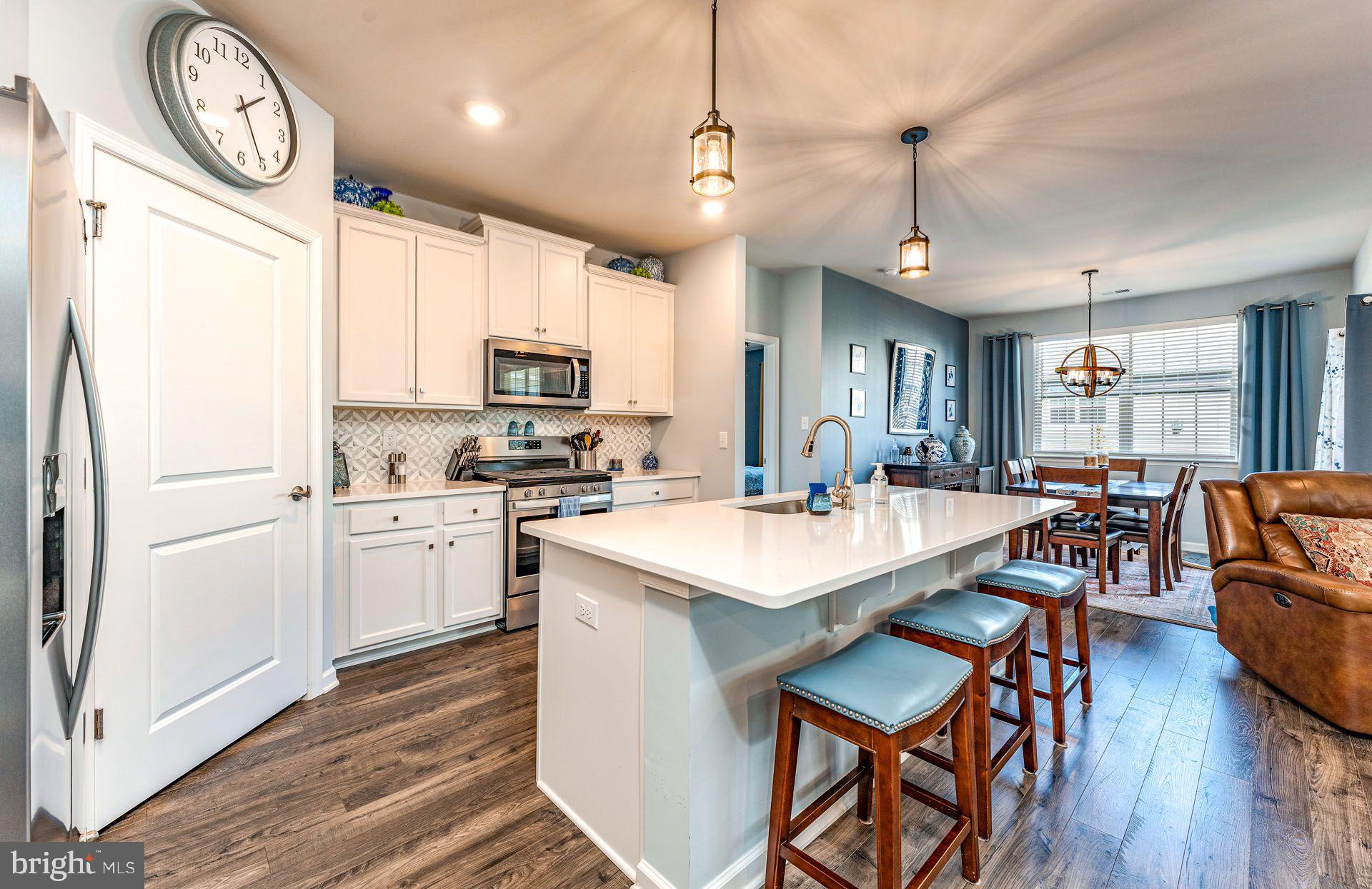 36 Walton Way Delanco, NJ 08075 - Photo 8 of 39 a large kitchen with a table chairs and a refrigerator