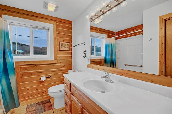 a bathroom with a bathtub and a sink
