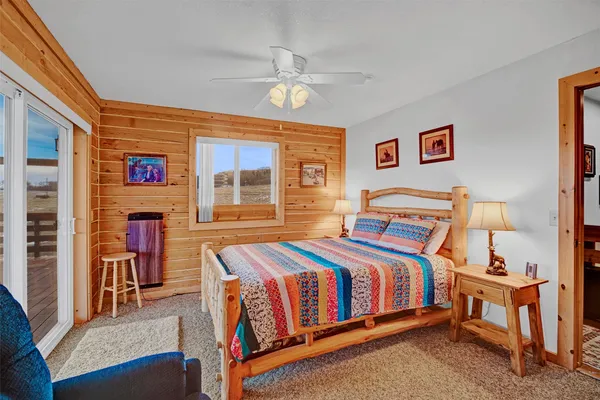 a view of a balcony with lake view and wooden floor