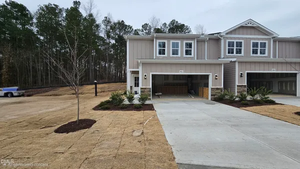 a front view of a house with yard