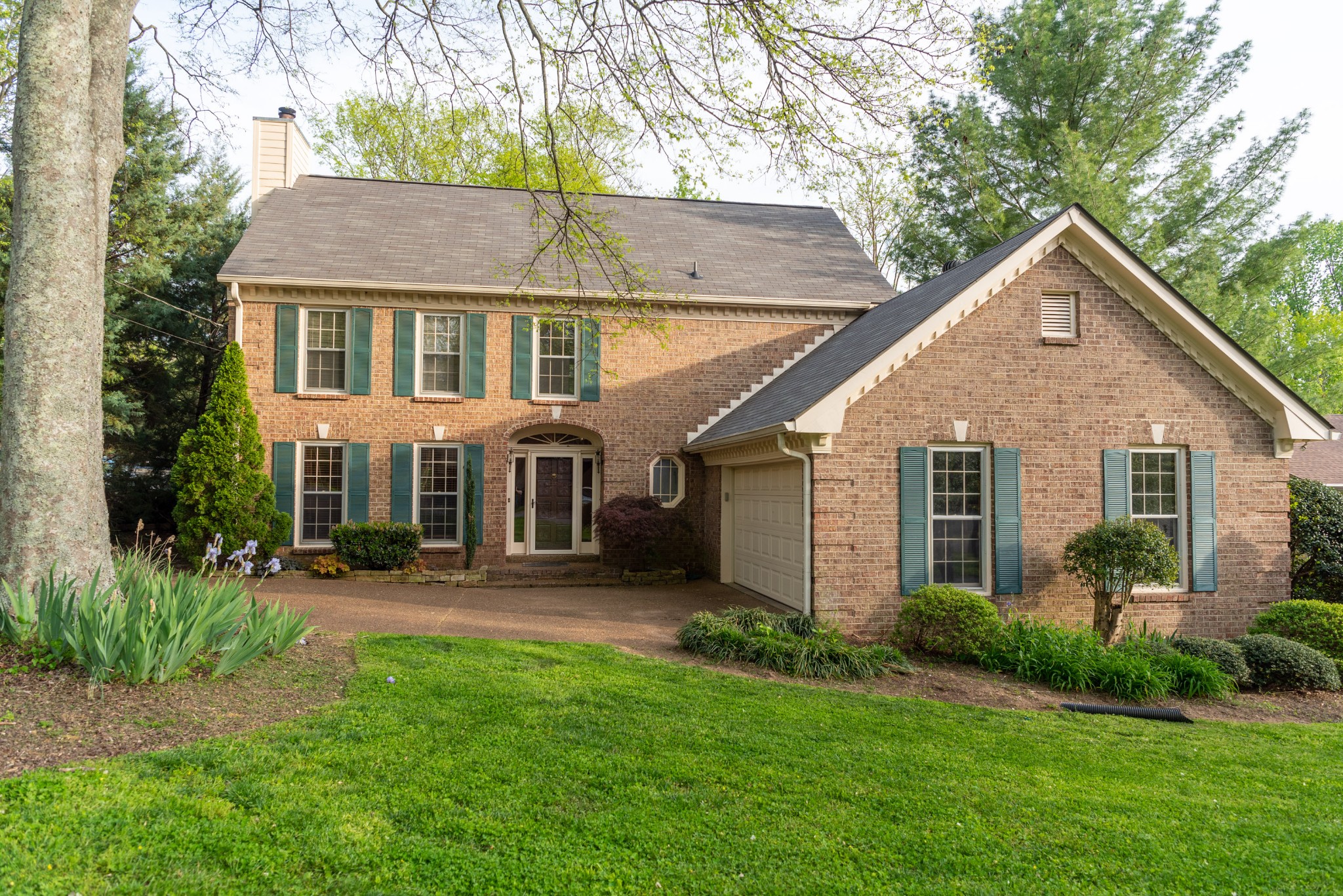 a front view of house with yard and outdoor seating
