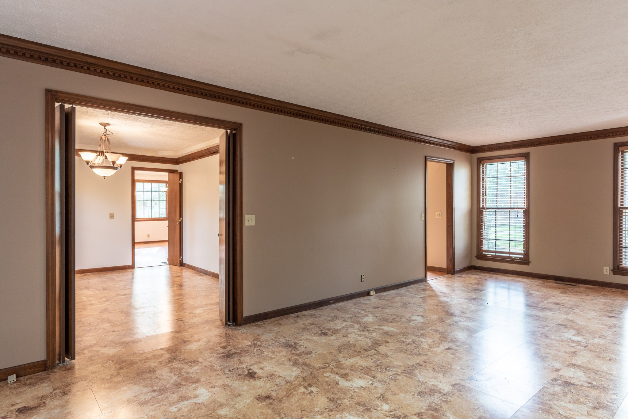 6948 Stone Creek Road Nashville, TN 37221 - Photo 15 of 37 a view of a livingroom with wooden floor and windows
