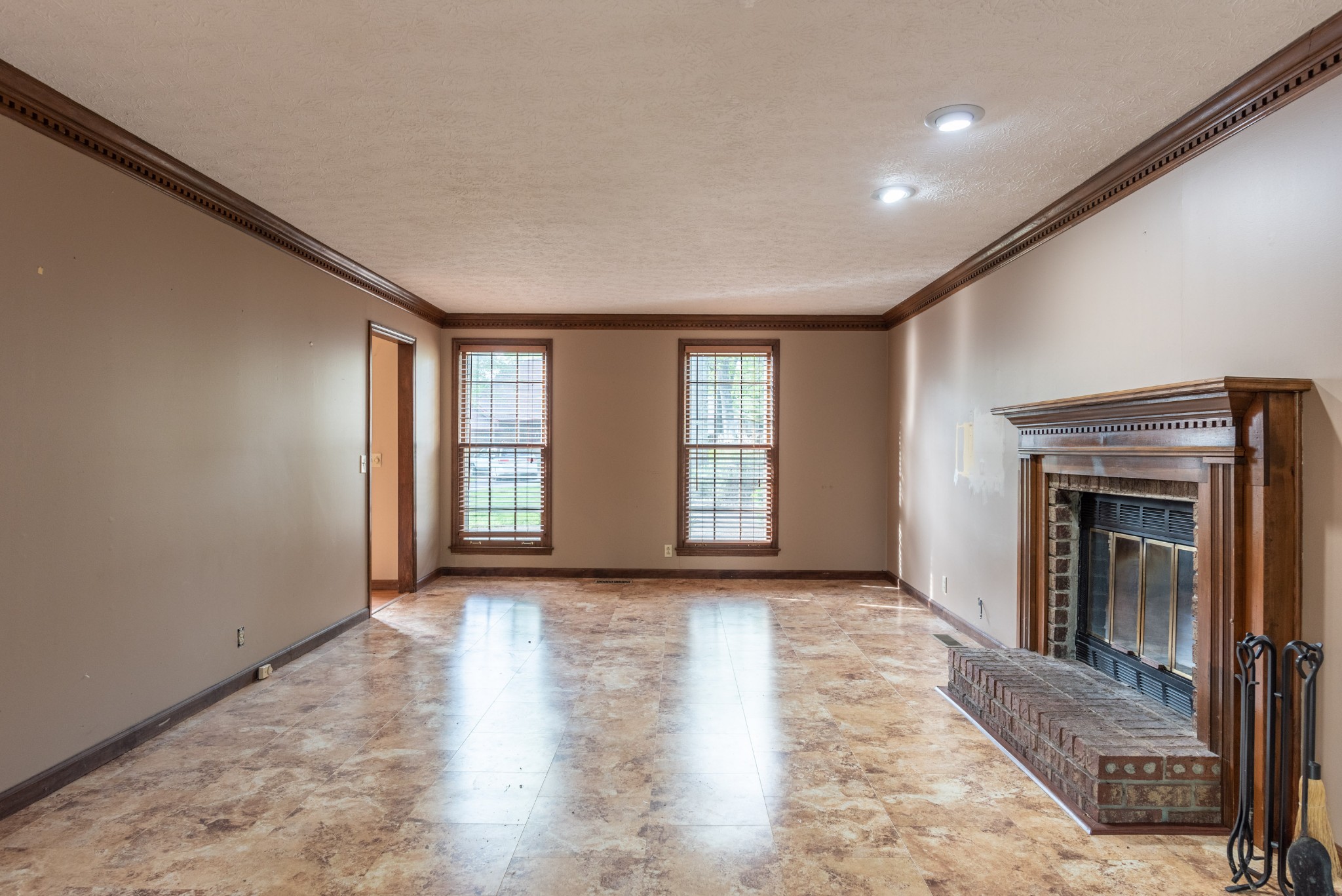 6948 Stone Creek Road Nashville, TN 37221 - Photo 18 of 37 a view of an empty room with window and fire place