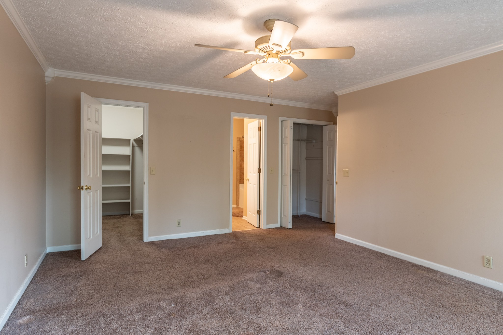 6948 Stone Creek Road Nashville, TN 37221 - Photo 23 of 37 an empty room with a ceiling fan and window