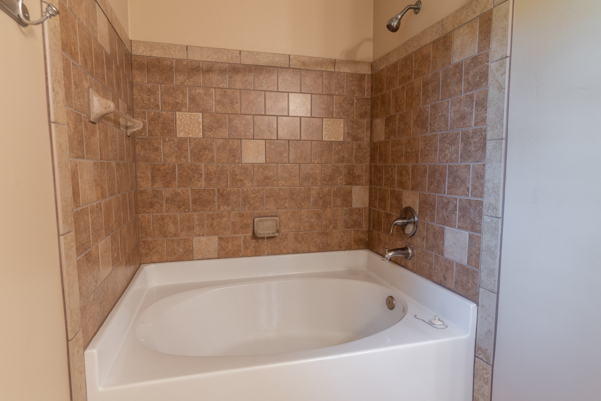 6948 Stone Creek Road Nashville, TN 37221 - Photo 26 of 37 a bathroom with a bathtub