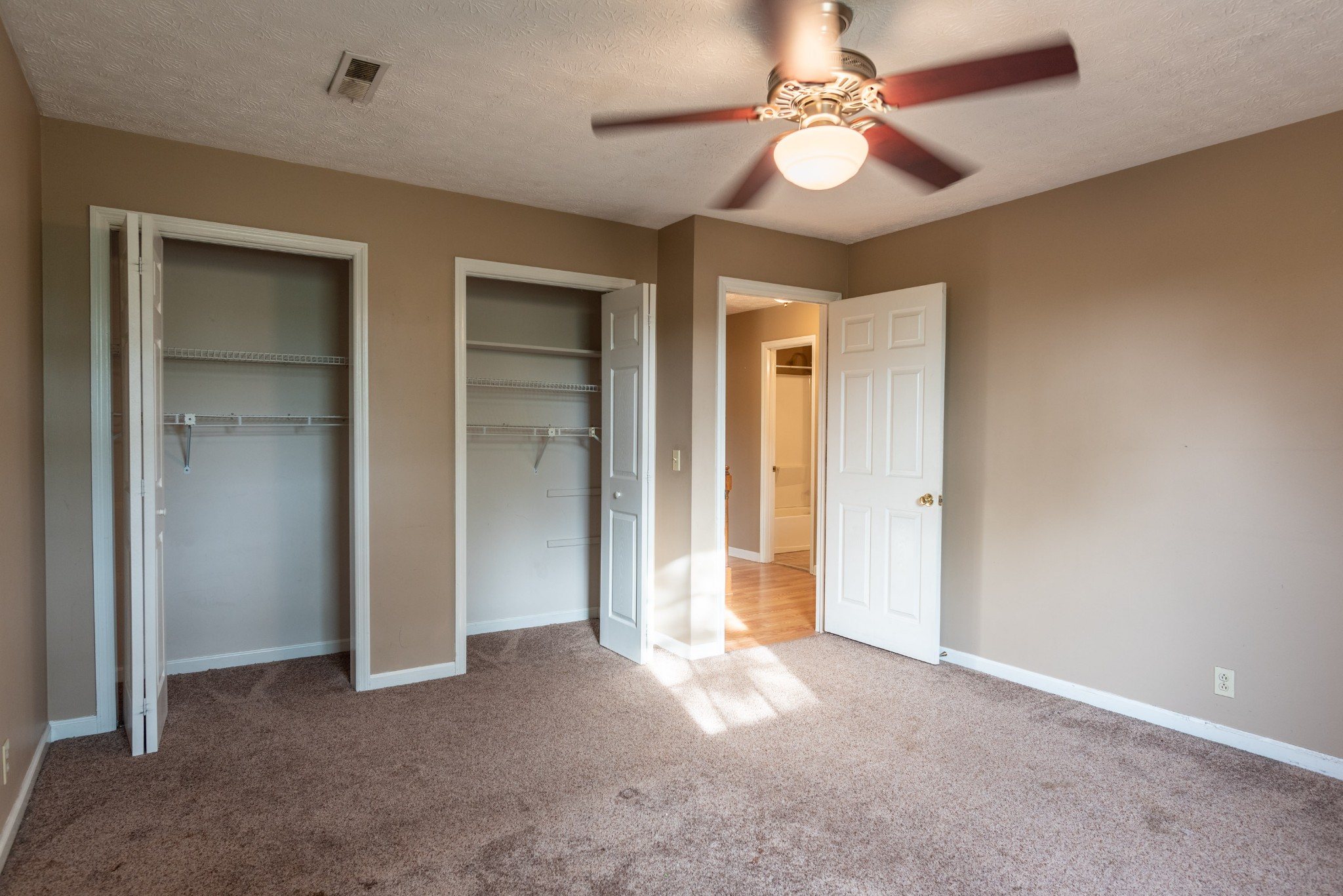6948 Stone Creek Road Nashville, TN 37221 - Photo 31 of 37 a view of empty room with a ceiling fan