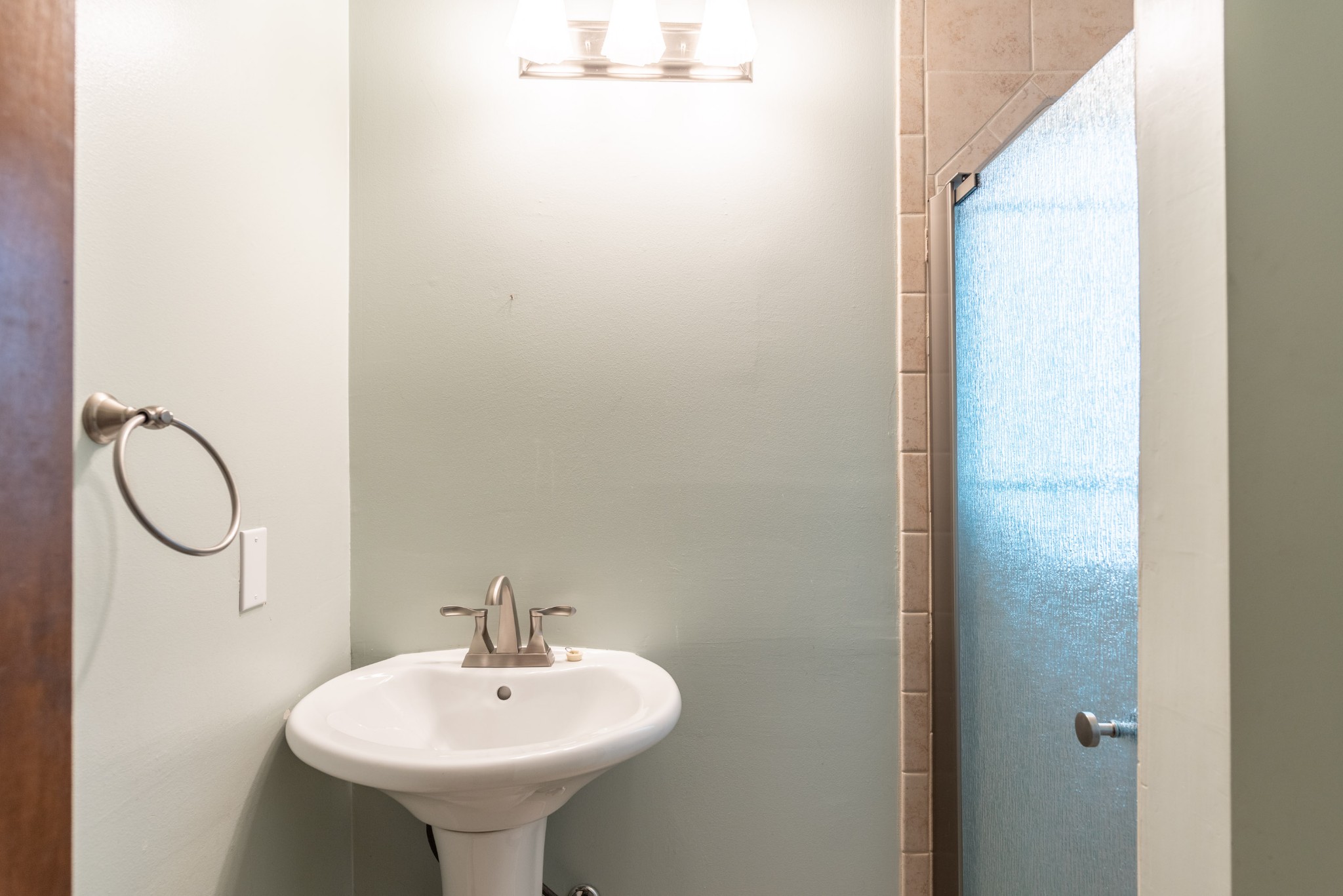 6948 Stone Creek Road Nashville, TN 37221 - Photo 33 of 37 a bathroom with a sink and a mirror