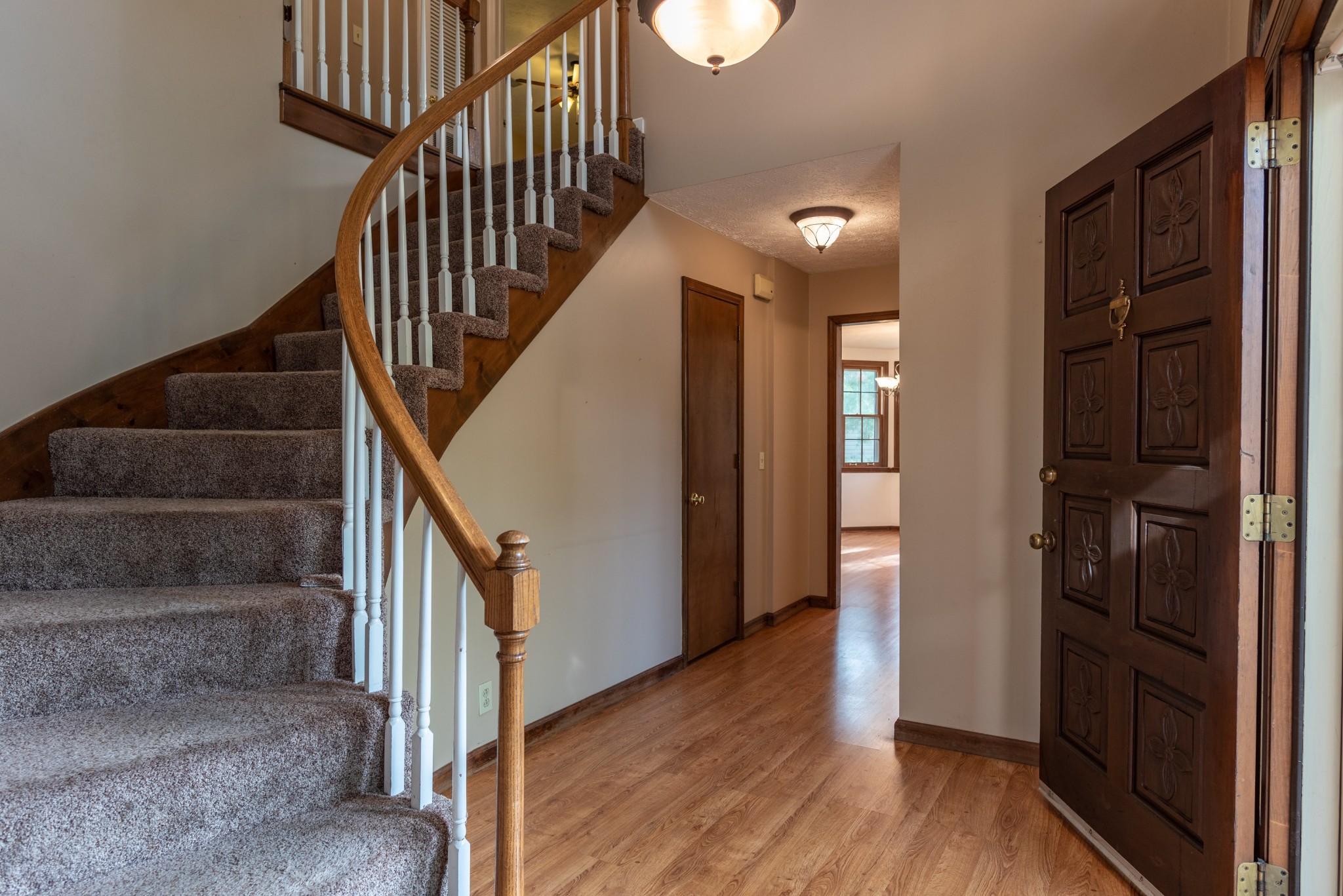 6948 Stone Creek Road Nashville, TN 37221 - Photo 5 of 37 a view of entryway and hall with wooden floor
