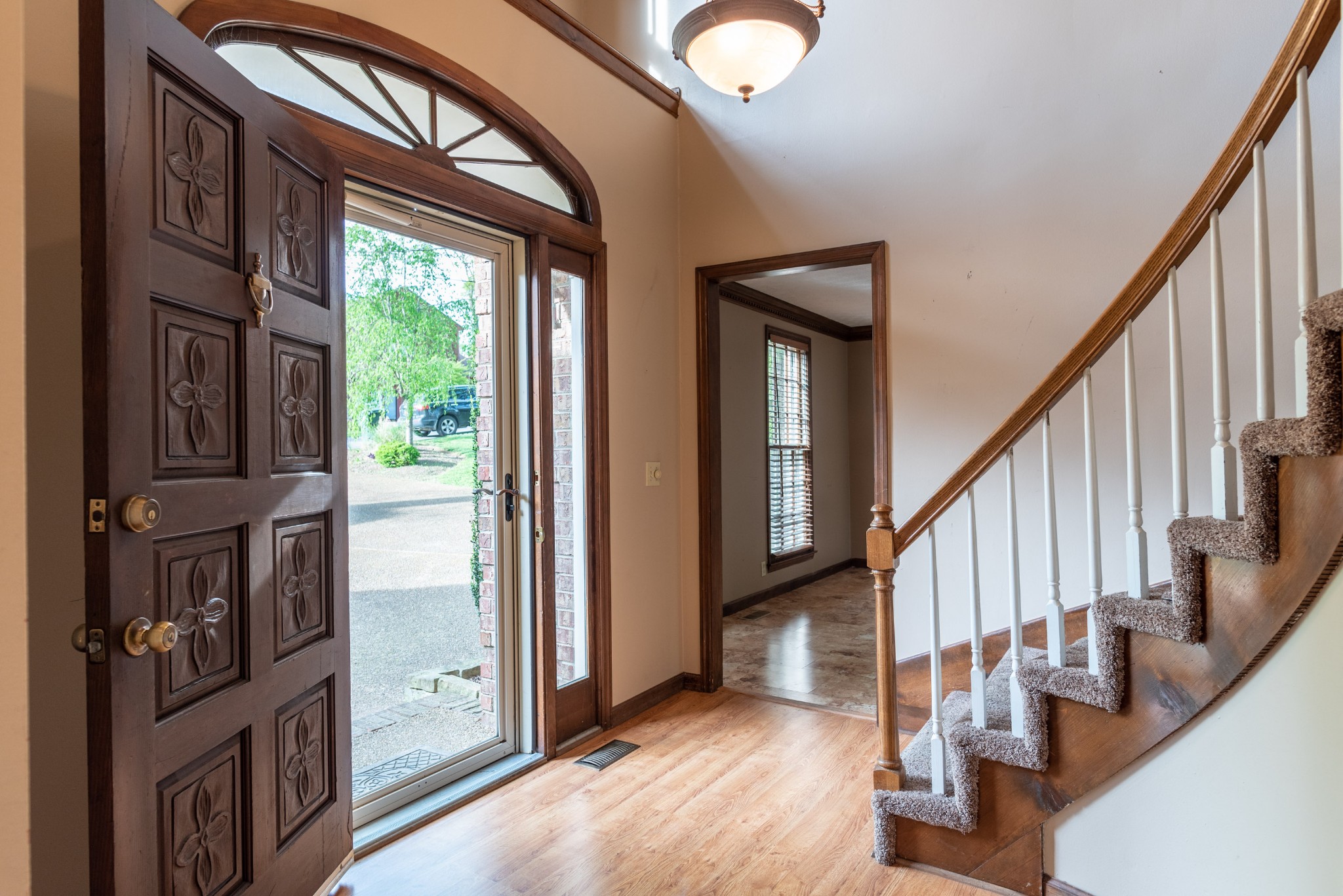 6948 Stone Creek Road Nashville, TN 37221 - Photo 6 of 37 a view of an entryway with wooden floor and windows