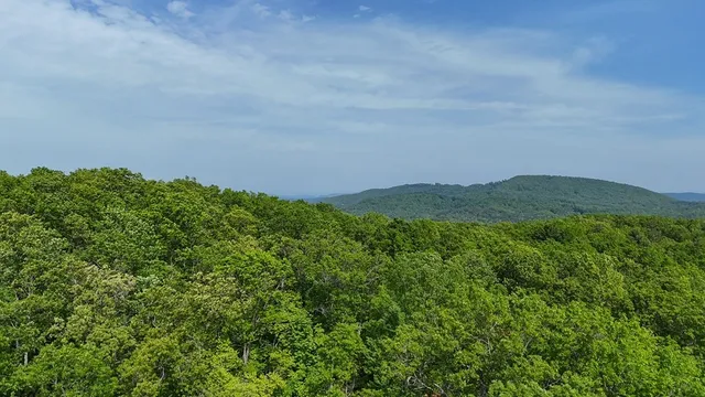 a sunset view with a green space
