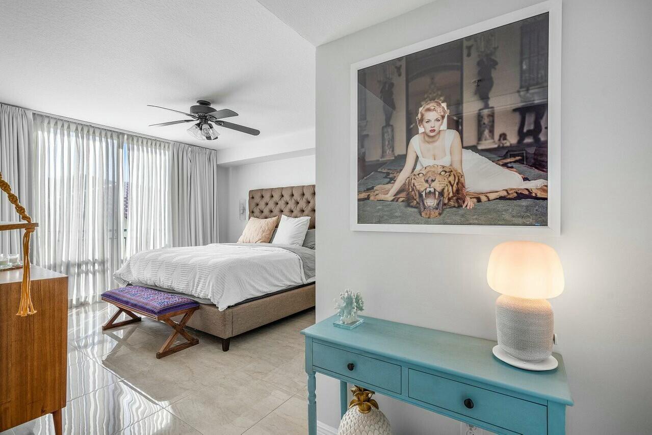 600 South Dixie Highway, Unit 331 West Palm Beach, FL 33401 - Photo 15 of 39 a bedroom with a bed and painting on the wall