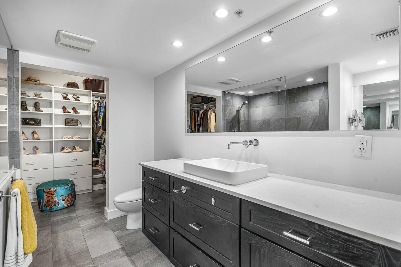 600 South Dixie Highway, Unit 331 West Palm Beach, FL 33401 - Photo 19 of 39 a bathroom with a sink double vanity and a shower