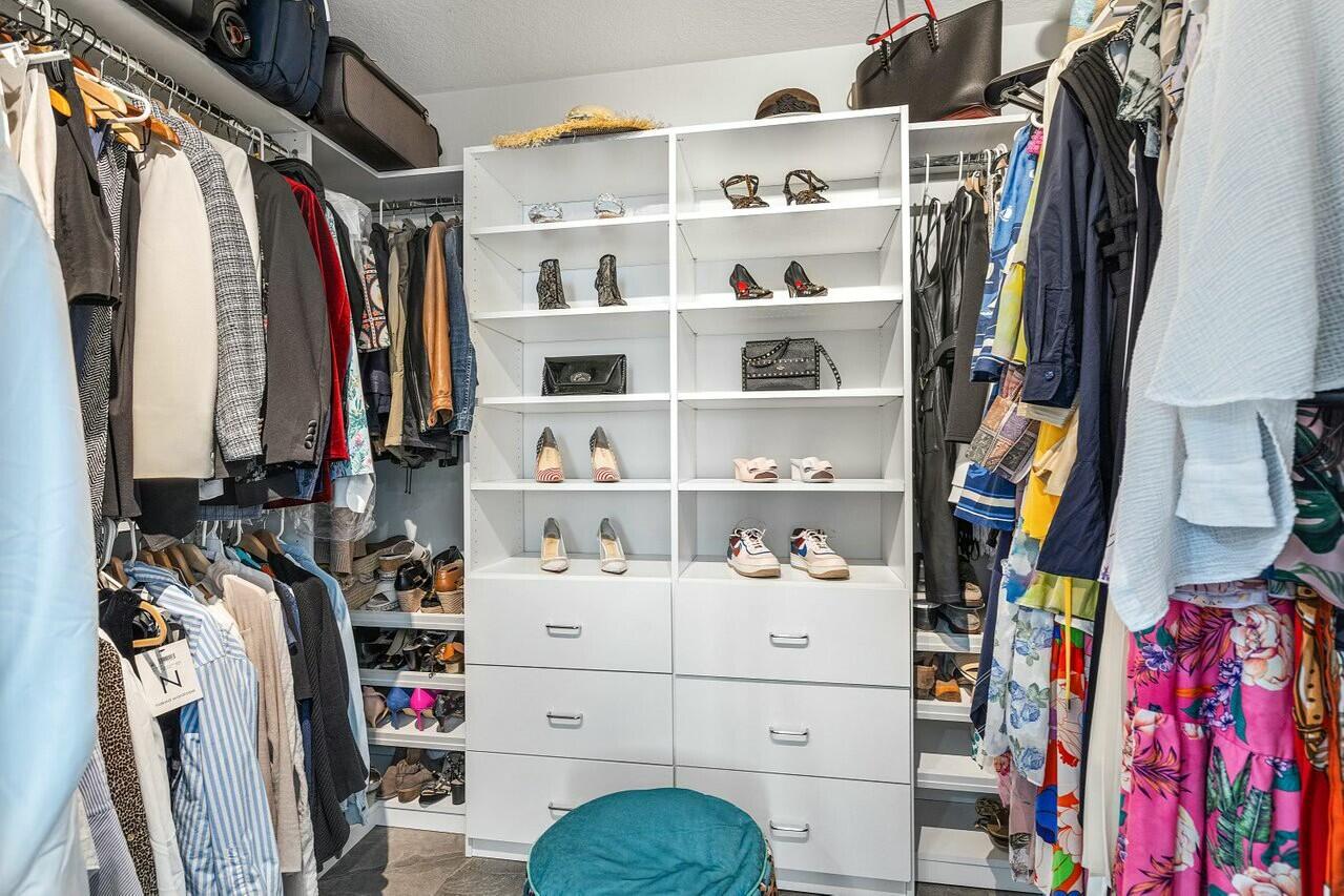 600 South Dixie Highway, Unit 331 West Palm Beach, FL 33401 - Photo 20 of 39 a view of walk in closet with clothes and shoes