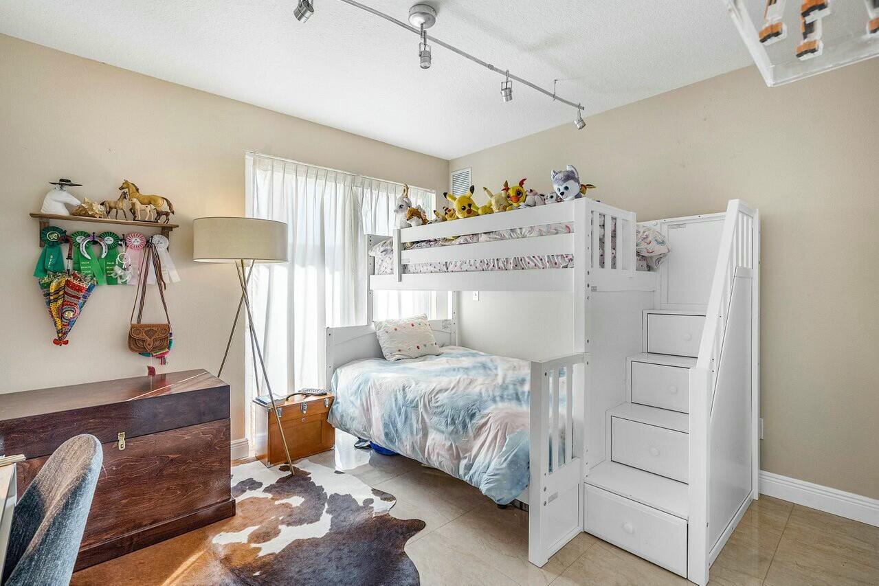 600 South Dixie Highway, Unit 331 West Palm Beach, FL 33401 - Photo 22 of 39 a bedroom with a bed and a dresser