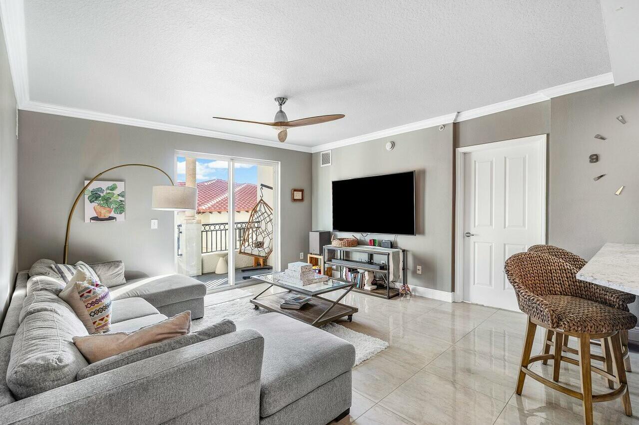 600 South Dixie Highway, Unit 331 West Palm Beach, FL 33401 - Photo 6 of 39 a living room with furniture and a flat screen tv