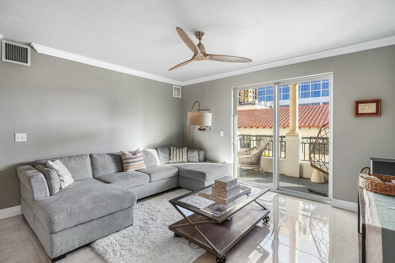 600 South Dixie Highway, Unit 331 West Palm Beach, FL 33401 - Photo 7 of 39 a living room with furniture and a large window